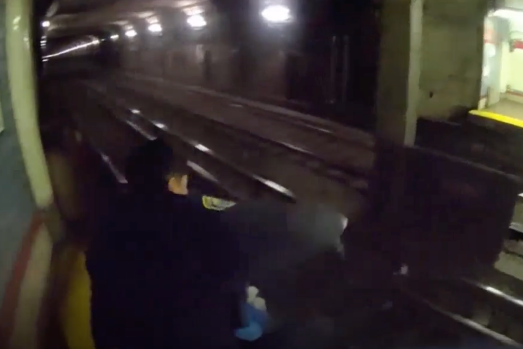 Cops leap on to rail tracks to save injured person with train just one minute away … from the Independent Holly Bishop